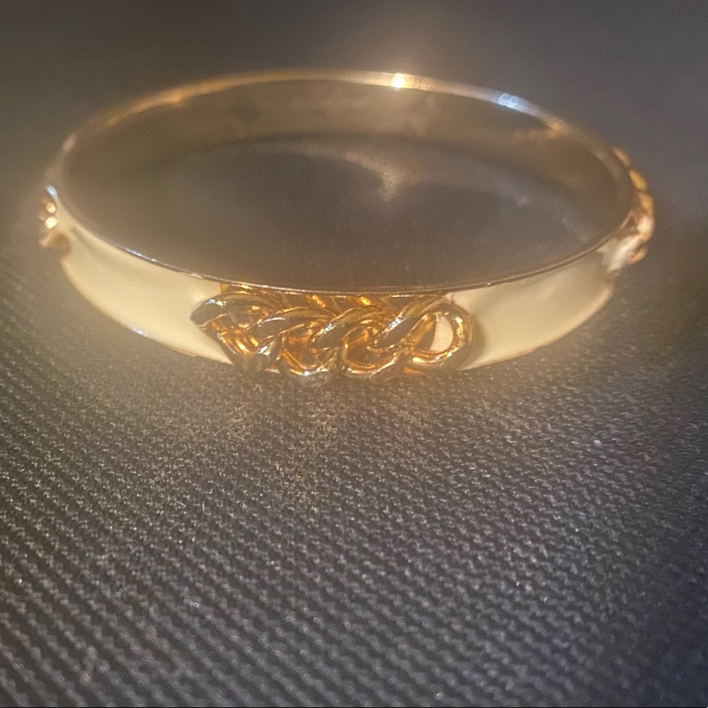 Chain, cream and gold bangle.